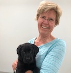 Barbara Bochner with black lab