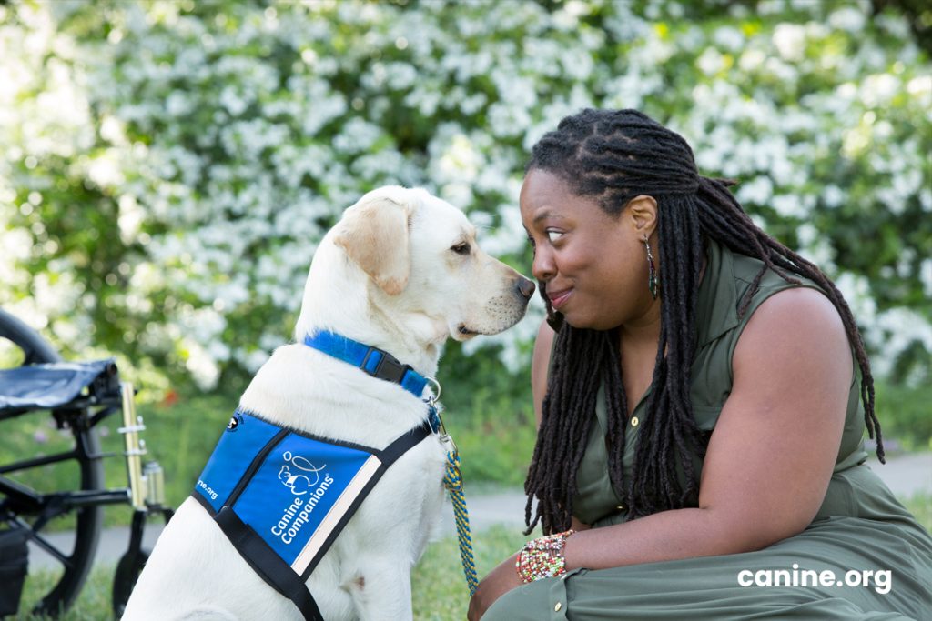 Graduate with her service dog