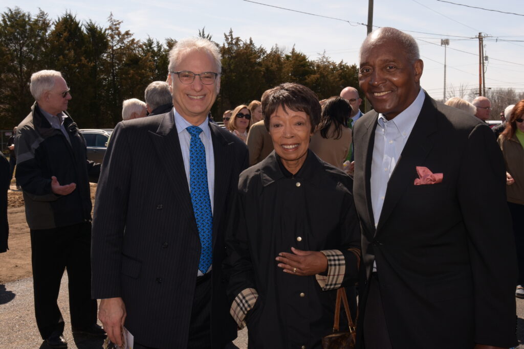 Peter, Joann and John standing together at Grand Opening