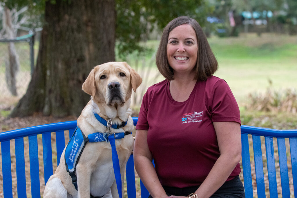 Woman sitting on bench with dog