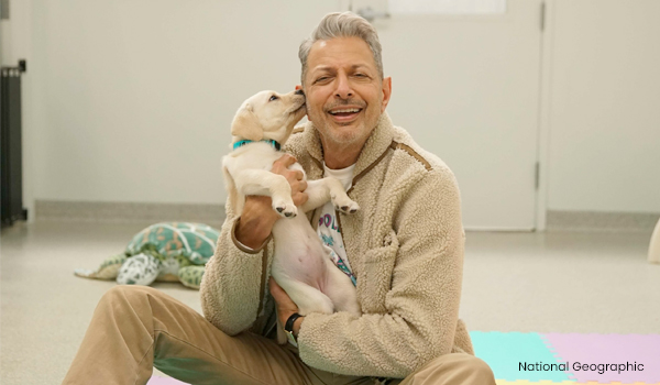 jeff Goldblu, holding Canine Companions puppy - photo credit National Geographic