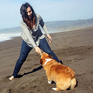 Rachel Sheppard and dog on the beach