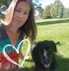 Tasha Haston with black lab and heart