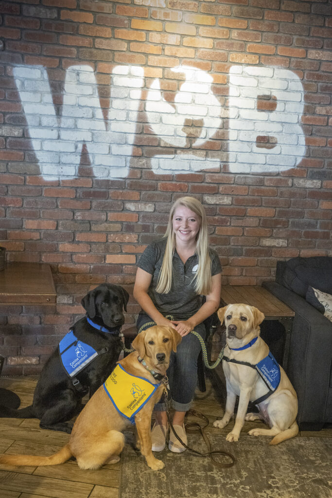 woman with three dogs